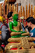 Chiang Mai - Wat Phra That Doi Suthep. The innercourtyard of the temple is filled with Buddha statues and other religious paraphenalia. 